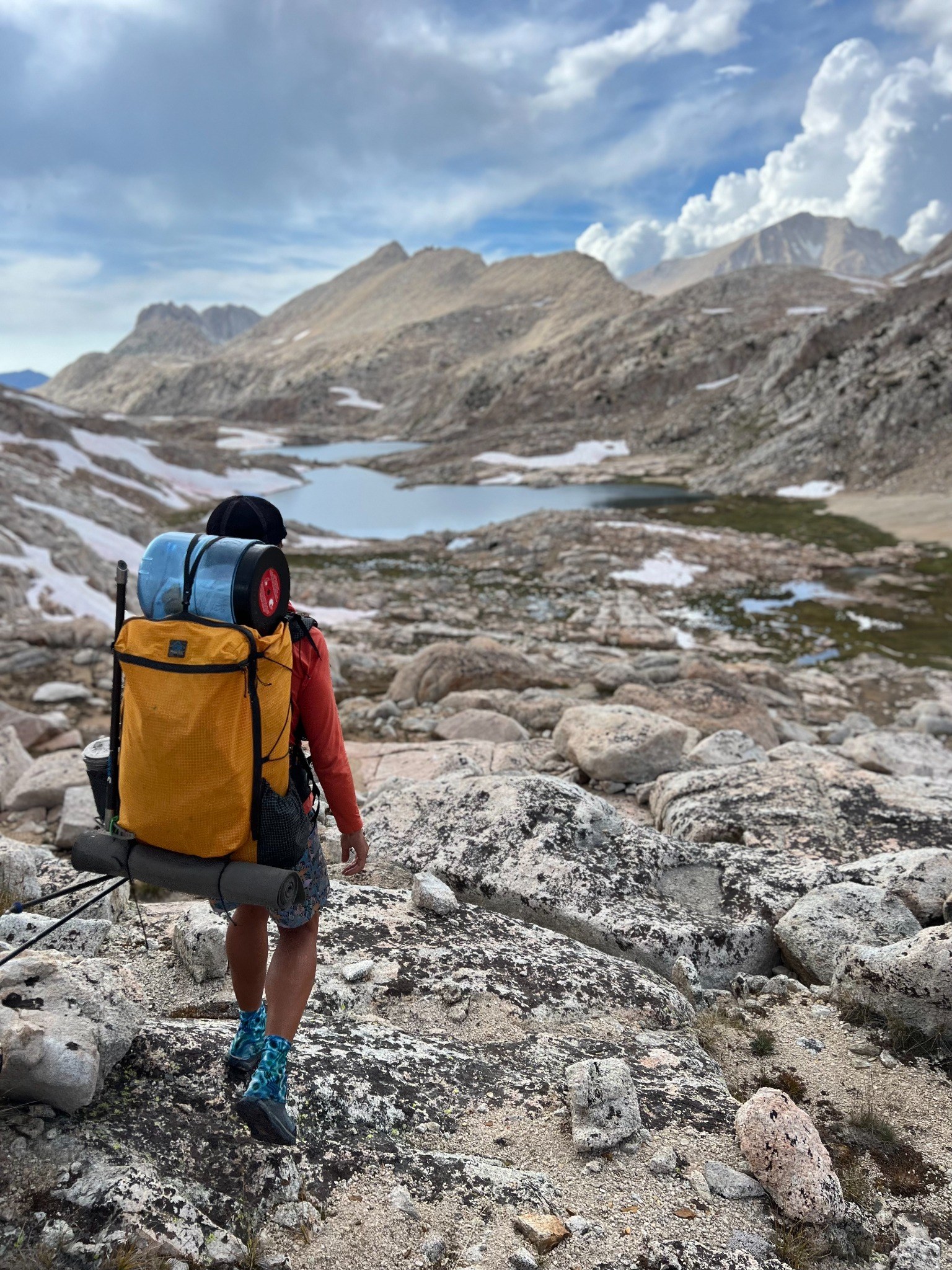 Backpacking through alpine lakes and mountain terrain
