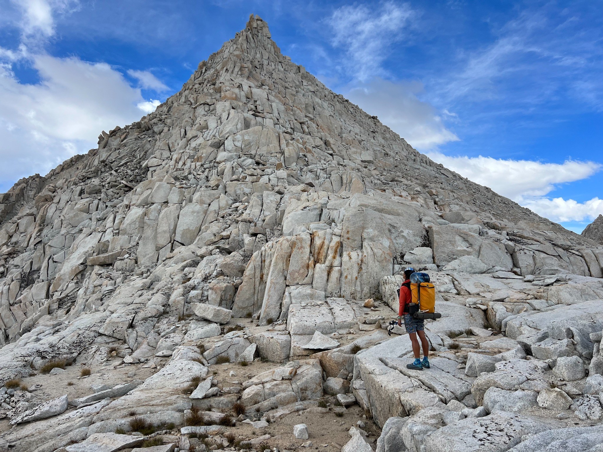 Standing before a granite mountain peak